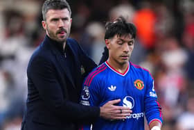 Manchester United manager Michael Carrick with Lisandro Martinez