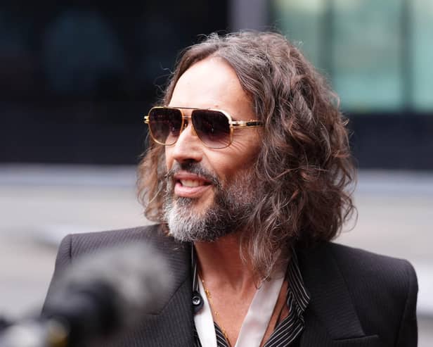 Russell Brand wearing sunglasses