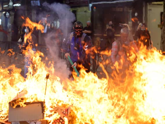 Protesters set fire to a barricade during clashes near the Education Ministry in Tirana, Albania
