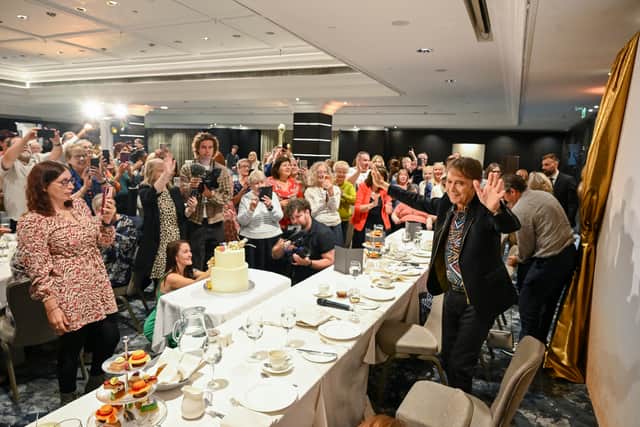 Sir Cliff Richard was presented with a two-tiered birthday cake (Sarah Jeynes/PA)