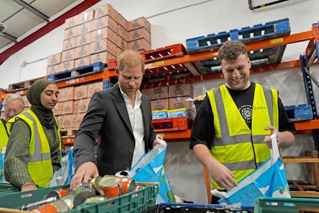 The Duke of Sussex helps pack a food parcel during a visit to Himmah Hub in Nottingham (Annabel Lee-Ellis/PA)