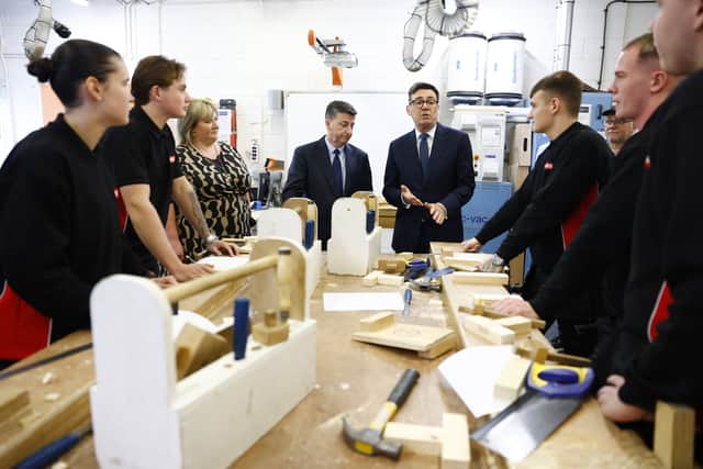 Andy Burnham, centre right, and Douglas Alexander during a visit to to a college in Motherwell, Lanarkshire (Jeff Mitchell/PA)