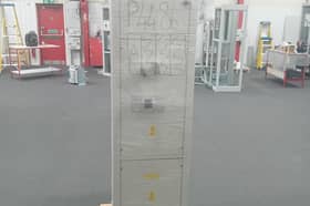 The switchboard equipment which fell on the victim.
