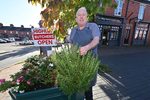 Local Butcher Ashley Barry poses next to one of the planters.