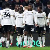 Wolves players celebrate after Tawanda Chirewa puts them 2-1 ahead at Burnley
