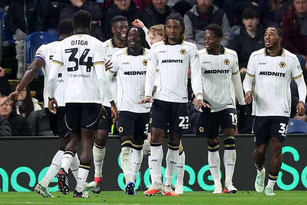 Wolves players celebrate after Tawanda Chirewa puts them 2-1 ahead at Burnley