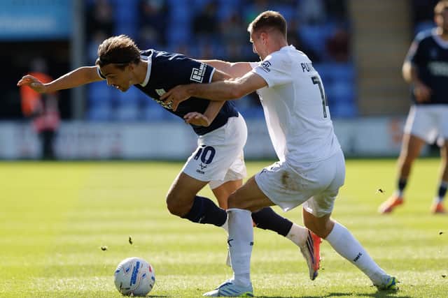 Tom Sang of Shrewsbury Town and Ben Purrington of Bristol Rovers