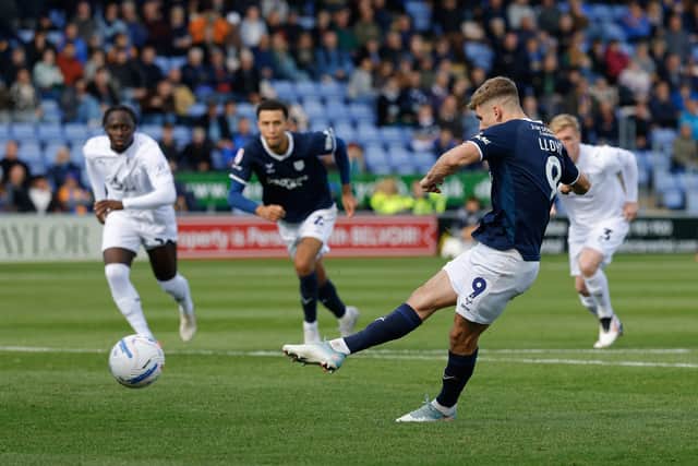 George Lloyd of Shrewsbury Town scores a goal to make it 1-0 from the penalty spot