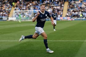 George Lloyd of Shrewsbury Town celebrates after scoring a goal to make it 1-0