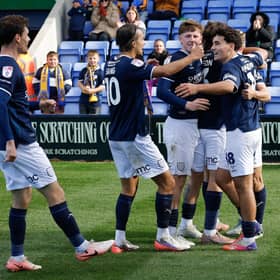 George Lloyd of Shrewsbury Town celebrates with his team mates after scoring a goal to make it 1-0