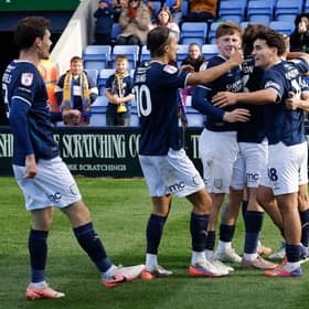 George Lloyd of Shrewsbury Town celebrates with his team mates after scoring a goal to make it 1-0