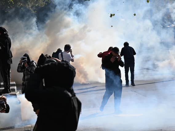 Protesters scuffle with police during a demonstration