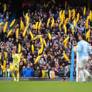 Manchester City fans with inflatable bananas in the stands against Ipswich