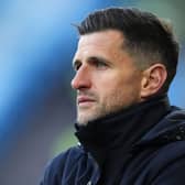 John Mousinho looks on