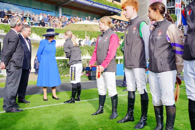 Queen Camilla spoke with jockey Saffie Osborne (Ben Birchall/PA)