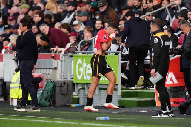Brentford’s Vitaly Janelt walks off after being sent off (John Walton/PA)