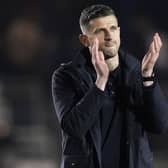 John Mousinho applauds the fans