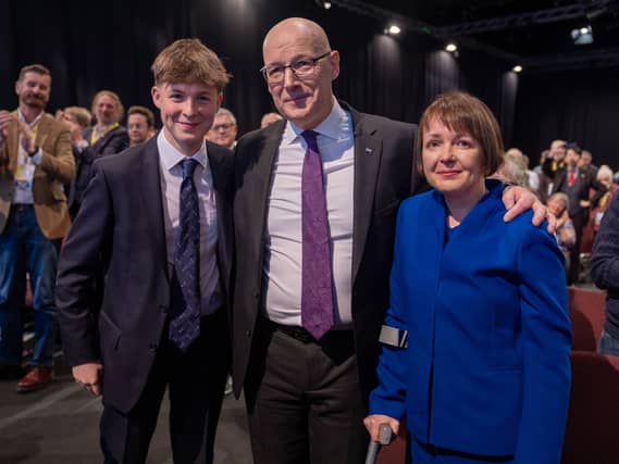 John Swinney, centre, with his son Matthew and wife Elizabeth