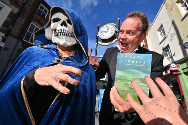 Pic in Wellington of Darren Bailey and Sue Humphries  from the Wrekin Writers , with a book that they and others have written , ghost stories from around the Wrekin area.