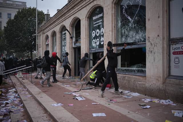 Protesters ransack a tourism office in Lyon (Laurent Cipriani/AP)