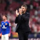 Manchester United manager Michael Carrick applauds the fans