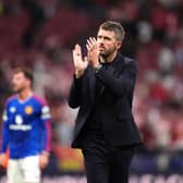 Manchester United manager Michael Carrick applauds the fans
