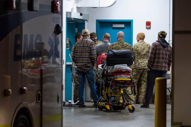 Emergency crews and military personnel are seen at the Wainwright Health Centre (John Ulan/The Canadian Press via AP)