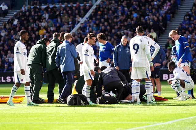 Chelsea goalkeeper Emiliano Martinez received treatment after a head clash at Everton (Mike Egerton/PA)