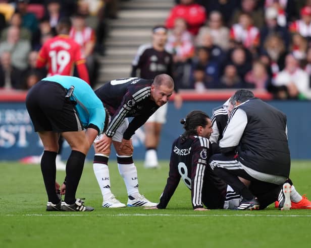Dominik Szoboszlai is treated on the pitch