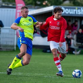 Whitchurch Alport goalscorer Ollie Holden in action against Uttoxeter