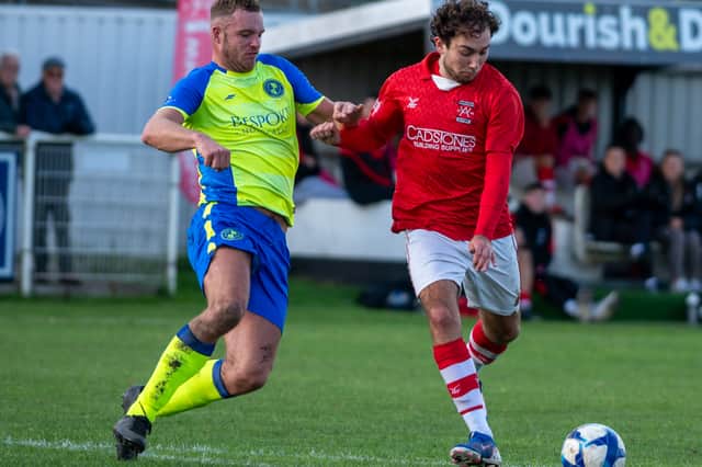 Whitchurch Alport goalscorer Ollie Holden in action against Uttoxeter