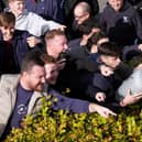 Crystal Palace fans gesture towards Brighton fans