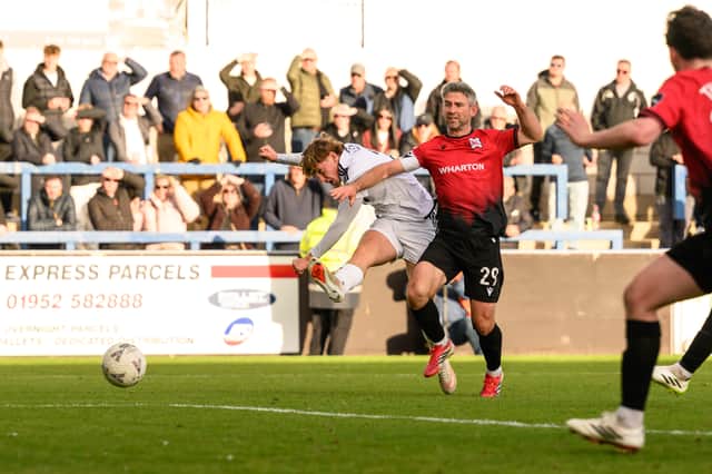Kian Ryley fires home the Bucks' winner under pressure from Darlington's Paddy McLaughlin Picture: Kieren Griffin