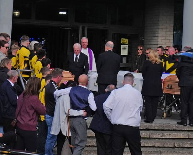 The four coffins of Philip and Kim English and their sons, Jayden and Callum, are carried into Sacred Heart Church Parish Centre in Waterford on Sunday