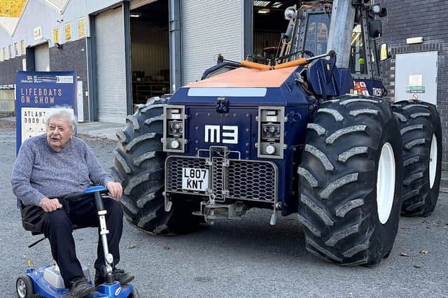 Landowner Roy Edwards looking at the RNLI tractor