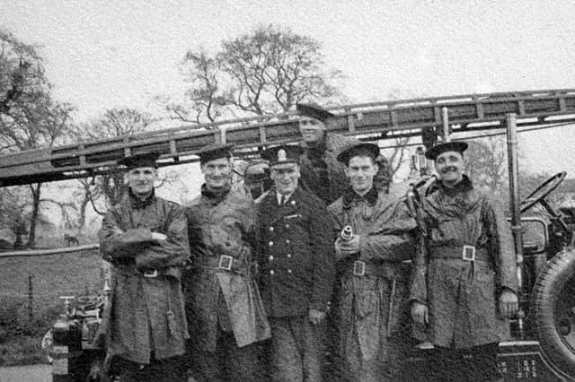 They fought crime, and they fought fires. From left: Tom Davies, Jack Laird, fire officer Walter Jones, Tom Meredith, “Bomber” Mills, and Ieuan Lloyd