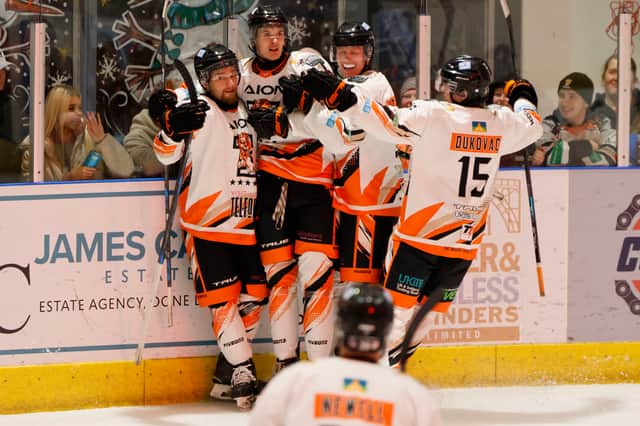 Telford Tigers celebrate Finley Howells scoring their third goal of the night against Basingstoke Bison