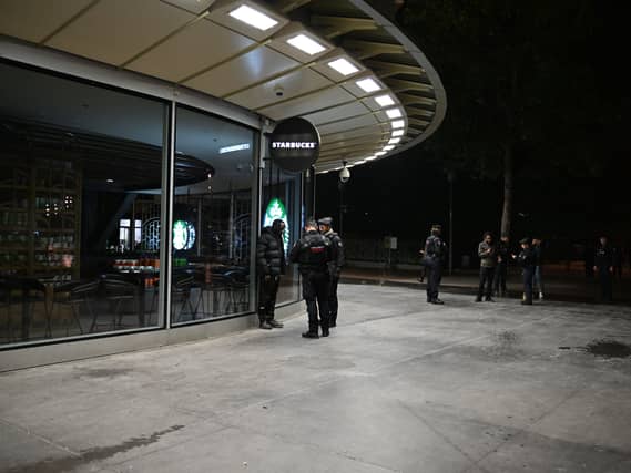 Policemen patrol during an overnight curfew in Paris