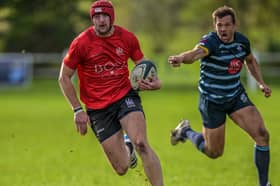 Ludlow's Henry Evans breaks through the DK defence en route to scoring his team’s first try Picture: Trevor Patchett