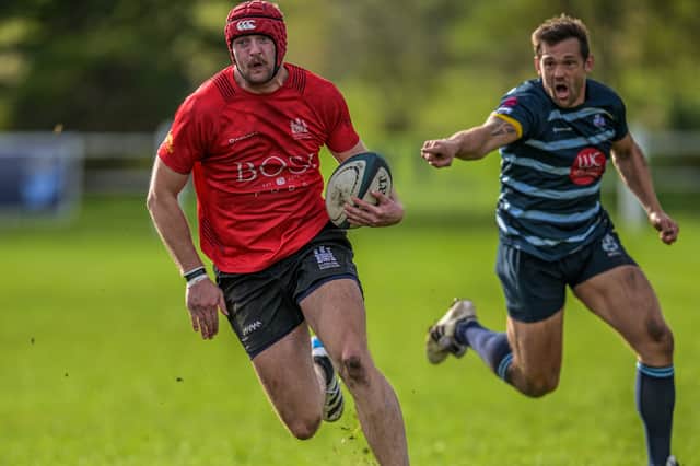 Ludlow's Henry Evans breaks through the DK defence en route to scoring his team’s first try Picture: Trevor Patchett