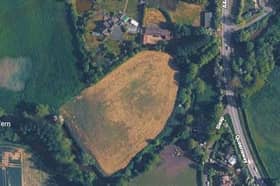 The site of a proposed four bed house on grassland in Crudgington