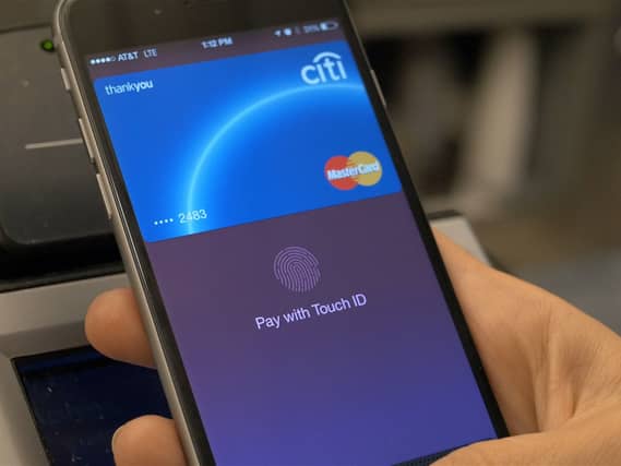 A person using their smartphone to pay