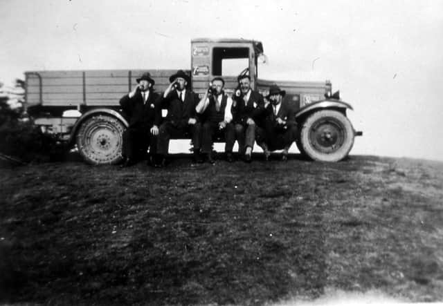 This is said to show celebrations after the successful ascent. But there are puzzling aspects. Where are the crowds? And what’s happened to the Chevrolet pennant on the bonnet? Is it even the same truck?