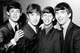Black and white image of The Beatles in 1963