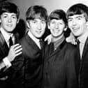 Black and white image of The Beatles in 1963