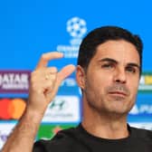 Mikel Arteta holds his thumb and forefinger a short distance apart during his pre-match press conference