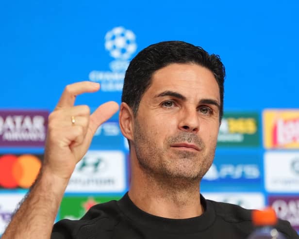 Mikel Arteta holds his thumb and forefinger a short distance apart during his pre-match press conference