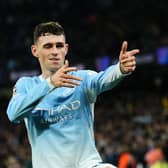 Manchester City’s Phil Foden celebrates scoring a hat-trick