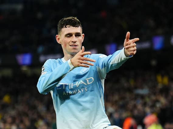 Manchester City’s Phil Foden celebrates scoring a hat-trick