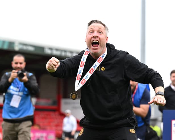 Cambridge manager Neil Harris celebrates